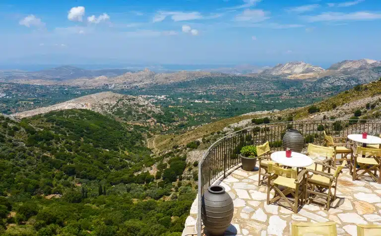 Aerial view of Apeiranthos from a tarrace with tables, Naxos