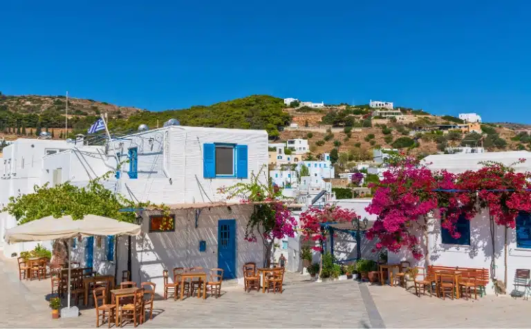 Lefkes, a picturesque village in Paros with white houses, blue doors and boucamvilles