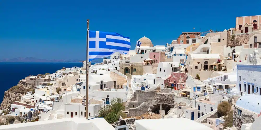 Santorini with greek flags